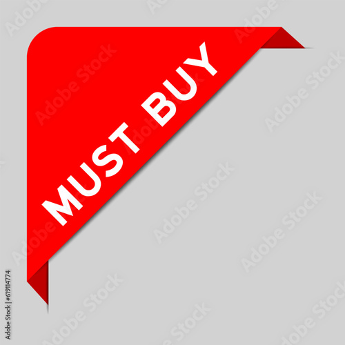 Red color of corner label banner with word must buy on gray background