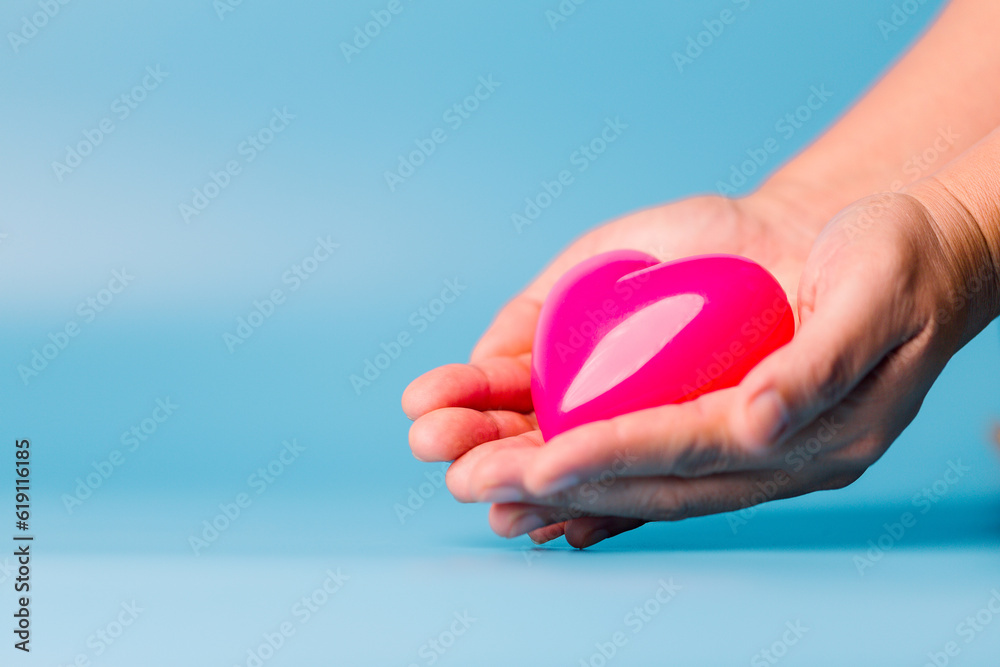 foster home concept. hands holding red heart, health care, love, organ donation, mindfulness, wellbeing, family insurance and CSR concept, world heart day, world health day, world mental health day. foster home concept. hands holding red heart, health care, love, organ donation, mindfulness, wellbeing, family insurance and CSR concept, world heart day, world health day, world mental health day.