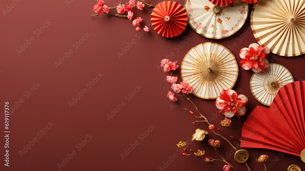 Chinese new year festival decorations made from chinese good luck symbol and plum blossom on a red background. Flat lay, top view with space