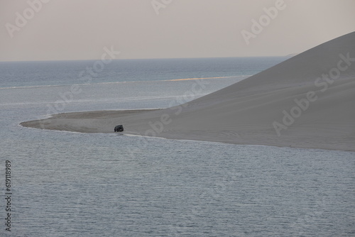 Photography Enthusiasts in Qatar drive to sand dunes in their SUV during weekends