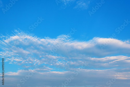 Clouds in the bright sky. There is space for text.