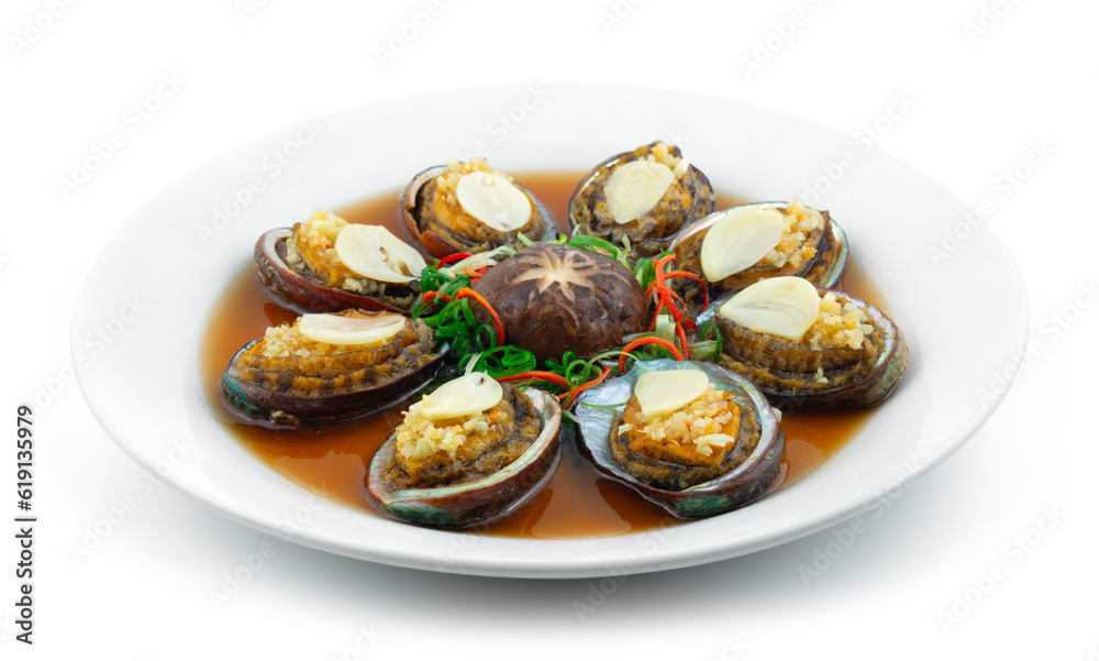 Steamed Abalone with Garlic decoration Mushroom Chinese New year menu Style sideview Steamed Abalone with Garlic decoration Mushroom Chinese New year menu Style sideview