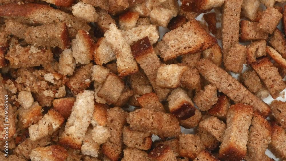 Rye Crackers Rotating. Bread Crispy Crackers Rotated On A White Flat Plate. Extreme Close Up. Top View. Macro. 4k. Rye Crackers Rotating. Bread Crispy Crackers Rotated On A White Flat Plate. Extreme Close Up. Top View. Macro. 4k.