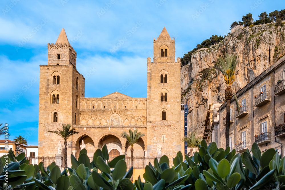 Norman cathedral with two towers in Cefalu, medieval town on Sicily island, Italy. Historic church in old town under La Rocca cliff. Popular tourist attraction in Province of Palermo