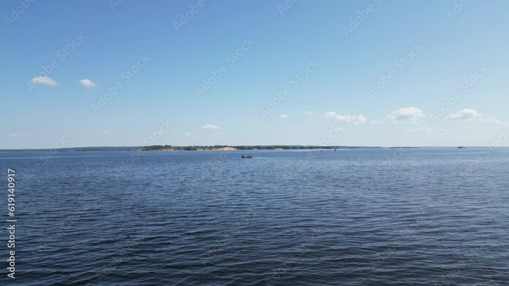We fly along the surface of the water on the Volga River. The fishermen are in the distance.
