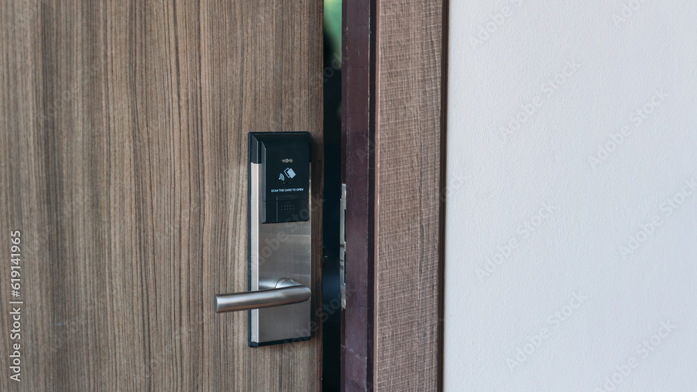 Electronic card key for open door in hotel. Smart card key to lock and unlock door. Security systems and protection concept.