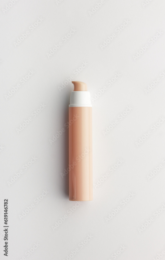 Cosmetic beige tube from above overhead top view on white background, blank mockup for your branding or packaging design, natural beauty product concept, vertical Cosmetic beige tube from above overhead top view on white background, blank mockup for your branding or packaging design, natural beauty product concept, vertical
