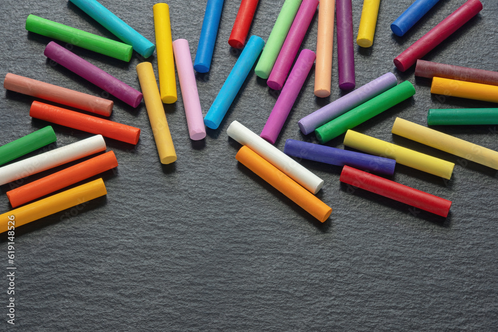 Colorful pastel crayons on dark background. Copy space Colorful pastel crayons on dark background. Copy space