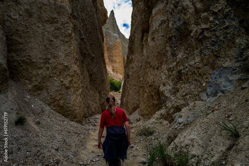 person climbing up the cliff