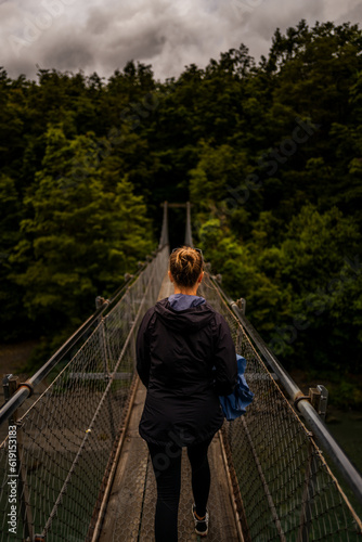 a woman on a bridge