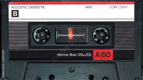 audio cassette plays in tape deck