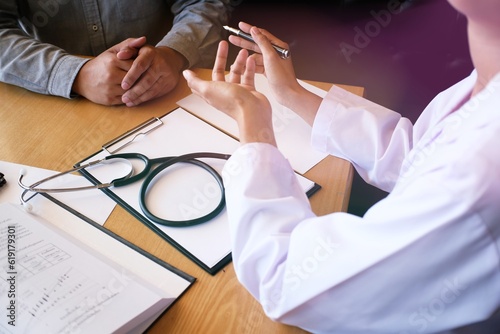 Professional medical doctor in white uniform gown coat interview consulting patient
