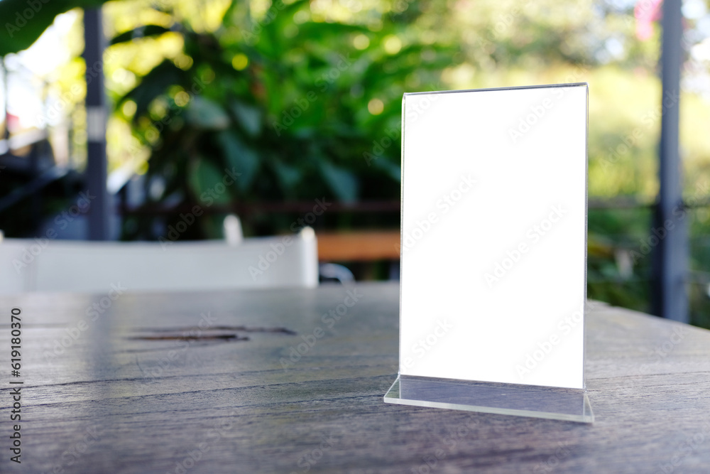Mock up Menu frame standing on wood table in Bar restaurant cafe. space for text. Mock up Menu frame standing on wood table in Bar restaurant cafe. space for text.