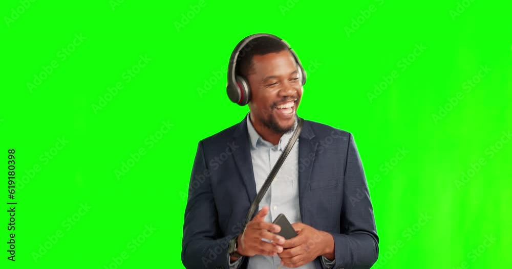 Green screen, thumbs up and happy man streaming music with a phone and listening to audio, radio or podcast. Greeting, wave and person excited and dancing due to mobile app, internet or online Green screen, thumbs up and happy man streaming music with a phone and listening to audio, radio or podcast. Greeting, wave and person excited and dancing due to mobile app, internet or online