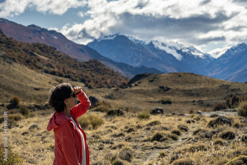 Senior woman looks into the distance in the Andes mountains in Santa Cruz, Argentina. photo