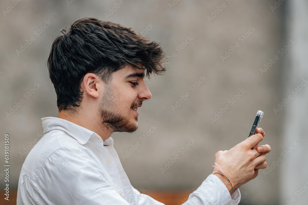 portrait of boy with mobile phone