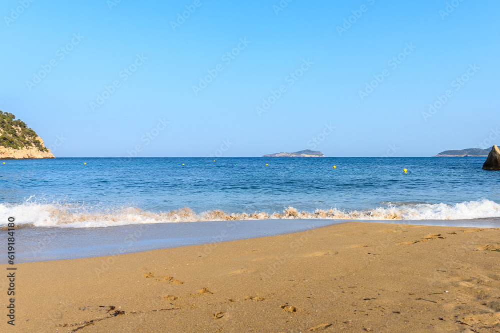 Waves crash at the beach in Cala San Vicente Ibiza Spain