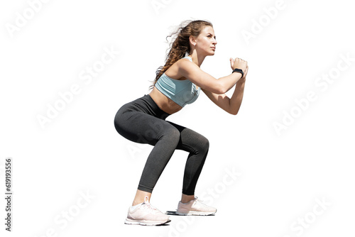 Full-height Fitness instructor trainer woman in a stylish tracksuit training for the buttocks. Transparent background, png.