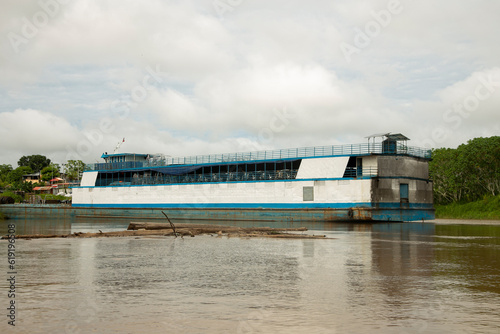 Ships transporting passengers and materials on the Huallaga River in the Peruvian Amazon.