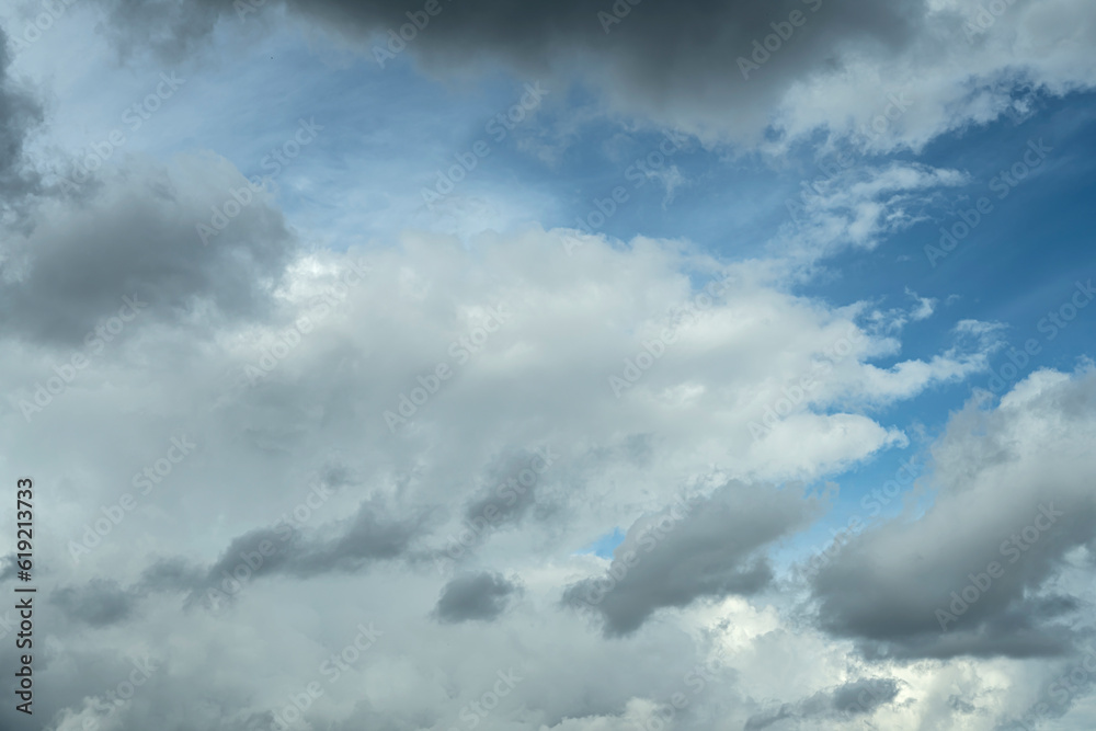 Obraz premium Blue sky with a moving cyclone of dark clouds