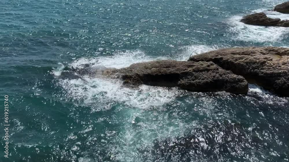 Ocean waves breaking on the rocks
