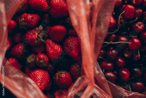 Colorful summer fruits in a plastic bag photo