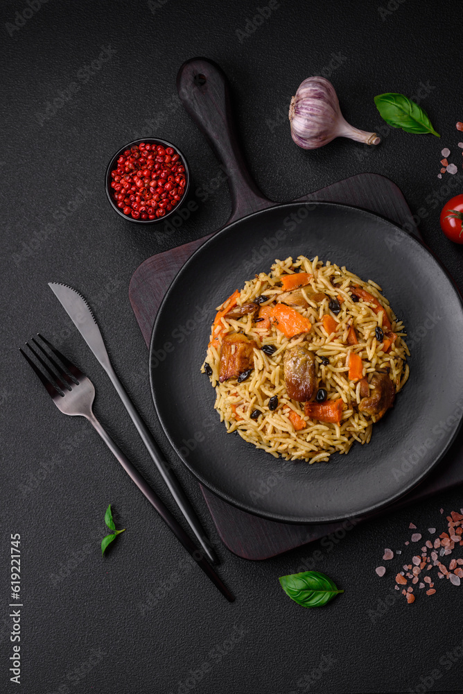 Delicious fresh pilaf with rice, carrots, meat, onions, spices and berries Delicious fresh pilaf with rice, carrots, meat, onions, spices and berries