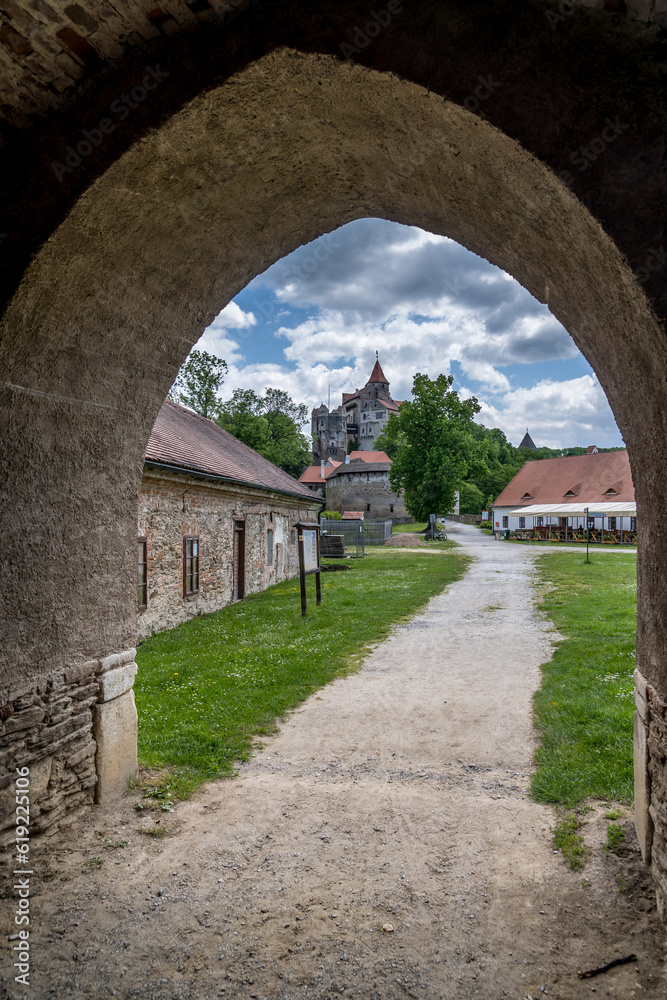 Pernstejn castle framed by the fortified gate arch