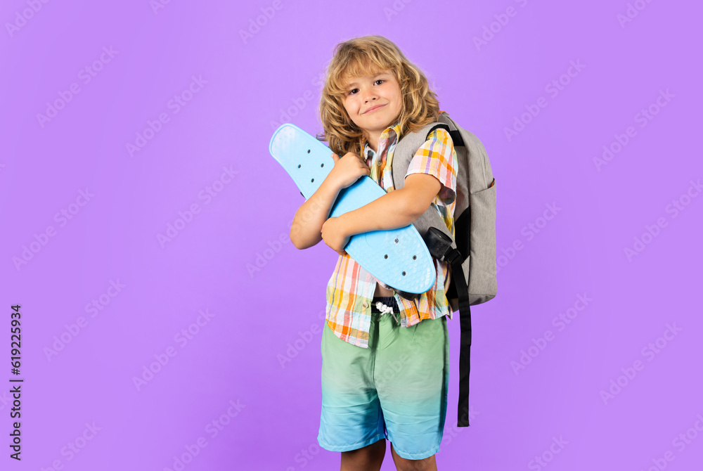 Child with skateboard in the studio. Kid having fun with penny board. Penny board, skateboard for children. Fashion child in shirt. Child with skateboard in the studio. Kid having fun with penny board. Penny board, skateboard for children. Fashion child in shirt.
