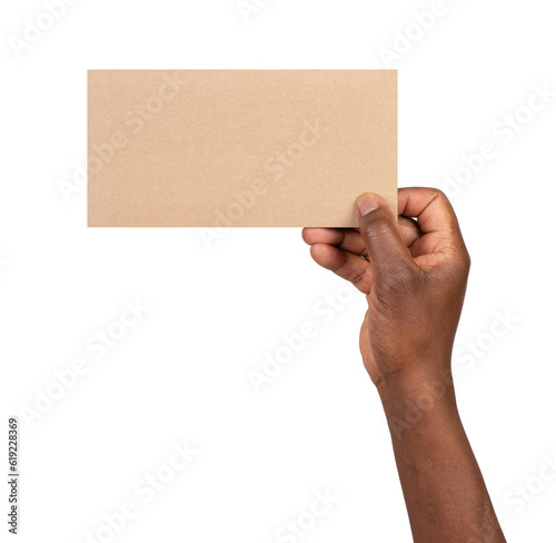 	
Man holding a blank rectangular piece of brown paper isolated on white or transparent background