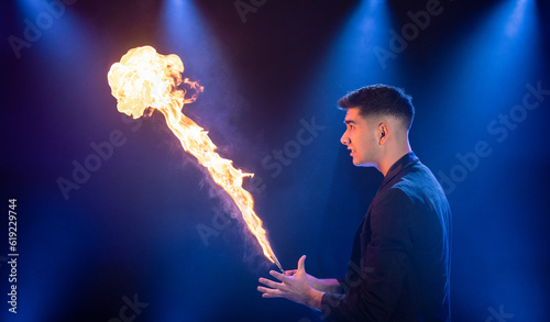 Man showing trick with fire photo