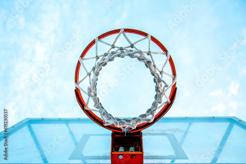 basketball hoop bottom view against the sky