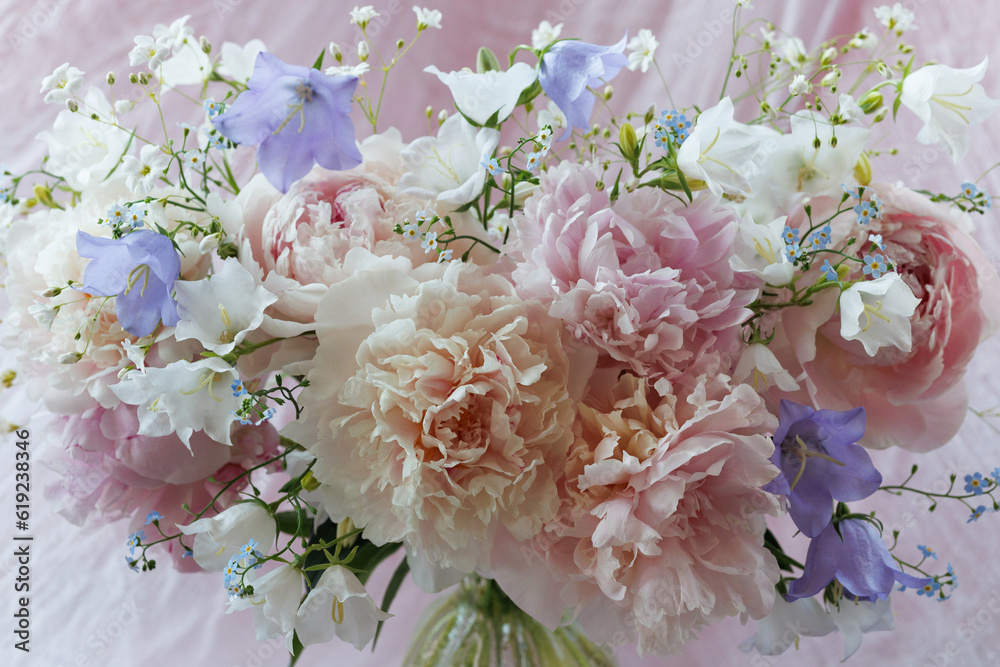 Bouquet of pink white peonies, forget me not, bluebell flowers and gypsophila closeup, blur, beautiful background, postcard. Bouquet of pink white peonies, forget me not, bluebell flowers and gypsophila closeup, blur, beautiful background, postcard.