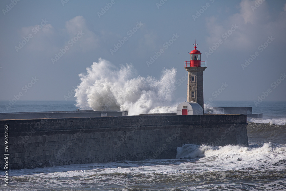 Farolim de Felgueiras during heavy winds with huge waves breaking over the light house
