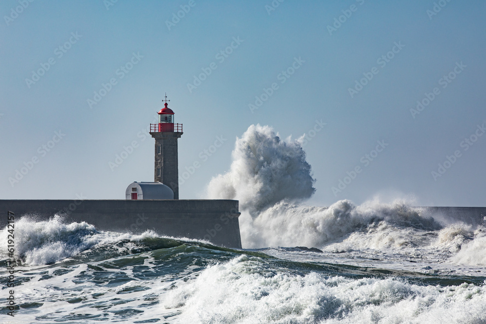 Farolim de Felgueiras during heavy winds with huge waves breaking over the light house