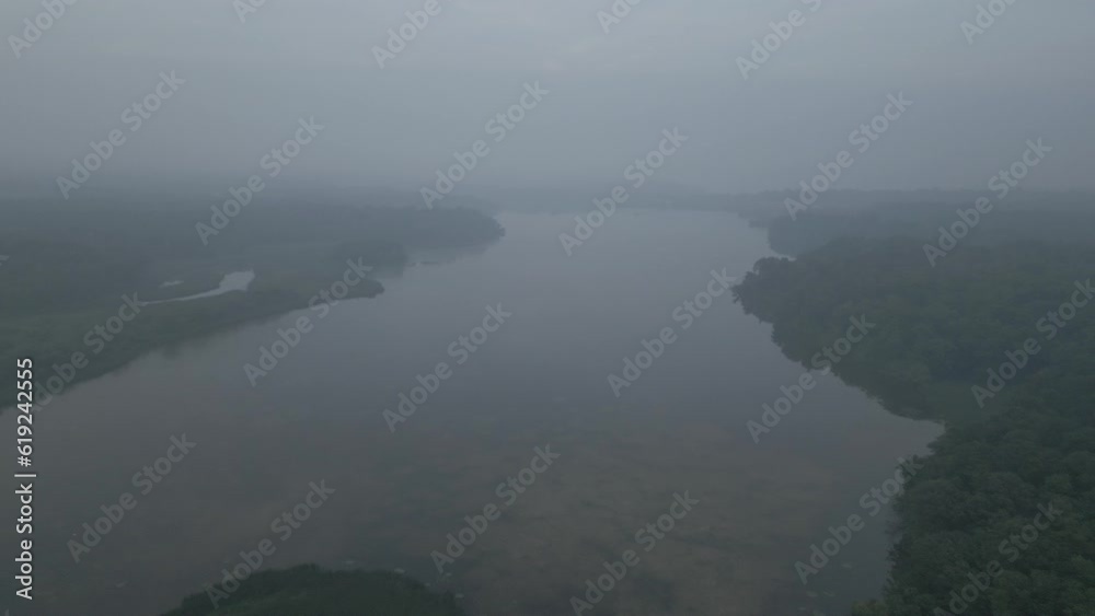 view of river, fog over the river, Hamilton, Ontario, Canada, forest fire smoke over the river, drone shot, sunset view of river, fog over the river, Hamilton, Ontario, Canada, forest fire smoke over the river, drone shot, sunset