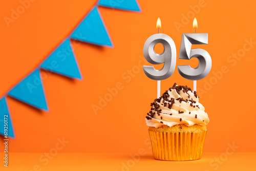 Birthday cake with candle number 95 - Orange background