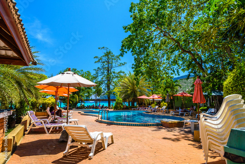 Bungalows houses  coconut palms and swimming pool on Ko Phi Phi Don Island on a sunny day  Ao Nang  Mueang Krabi District  Krabi  Andaman Sea  Thailand