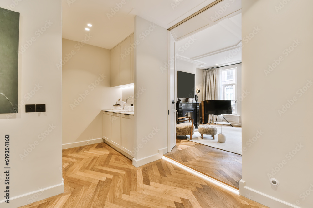 Fototapeta premium a living room with wood flooring and white walls in the background is a piano on the right side of the wall