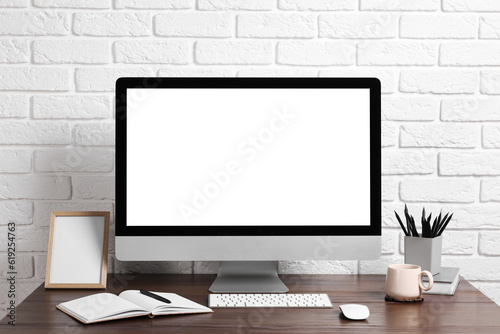 Cozy workspace with modern computer on wooden desk