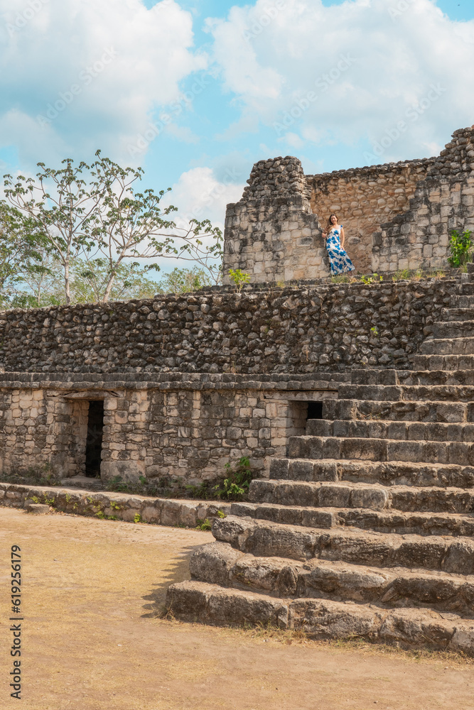 latin woman enjoying in her vacations in the pyramids of the archeological zone of ek balam in yucatan mexico