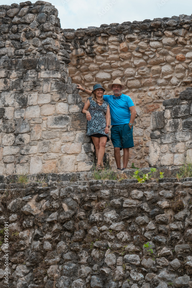 couple posing among the ruins of Ek Balam Archaeological Zone in the Mayan Riviera Yucatan Mexico
