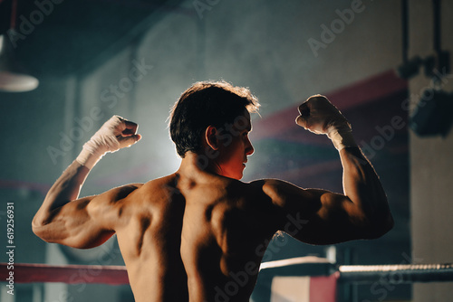 portrait of Asian man boxer having strength body are working out exercise in gym, athlete sportsman fighter male person having strong muscle training active in sport fitness gym for muscular power up