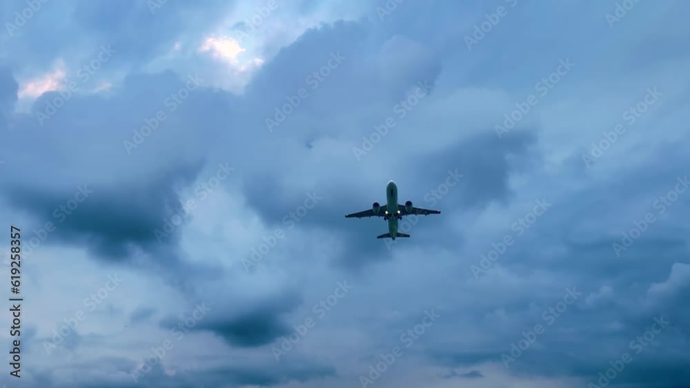 Large passenger airplane, airliner is taking off, gaining altitude and flying in the cloudy sky in the evening. Transportation, journey, flight and tourism concept Large passenger airplane, airliner is taking off, gaining altitude and flying in the cloudy sky in the evening. Transportation, journey, flight and tourism concept