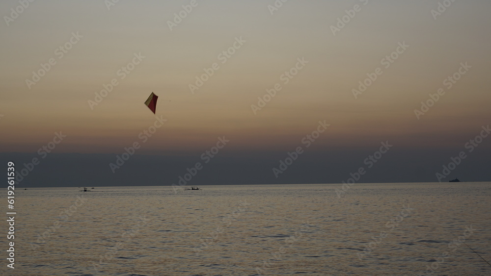 kite on the beach with a view of the sunset sky in Bali kite on the beach with a view of the sunset sky in Bali