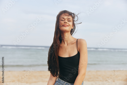Fototapeta Naklejka Na Ścianę i Meble -  woman smile lifestyle summer sunset vacation sea coast ocean sand beach