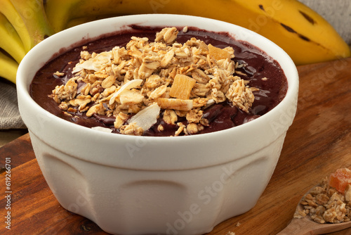 Brazilian açaí with granola in a bowl. Selective focus.