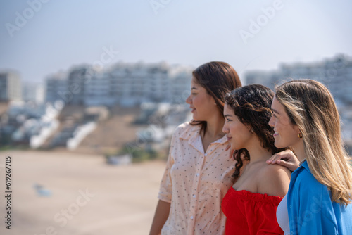 Three friends looking at the horizon