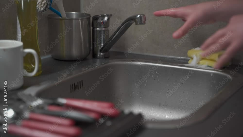 House cleaning, household chores. Washing dishes and kitchen utensils