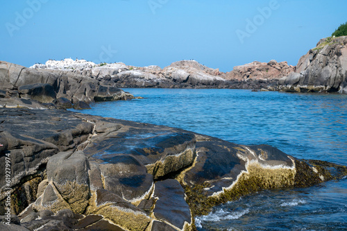 sea rock landscape with blue water and sky 